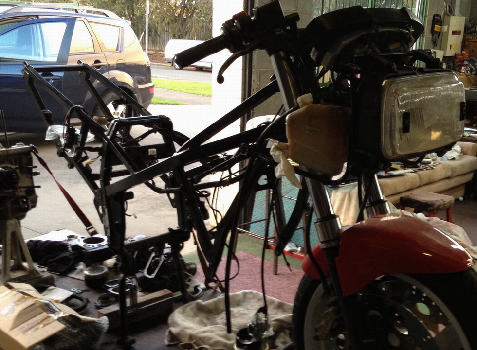You can see the plate attached to my bike as we stripped it down.  Before workshop move!